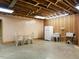 Basement featuring a retro table, sink, fridge, and ample storage space at 2228 Walker Ave, Burlington, NC 27215