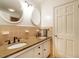 Bathroom featuring double sinks, granite countertops, and a tiled backsplash at 2228 Walker Ave, Burlington, NC 27215