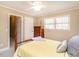 Bedroom features a four poster bed, neutral walls, and bright natural light at 2228 Walker Ave, Burlington, NC 27215