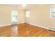 Bright, spacious bedroom with hardwood floors and natural light at 2228 Walker Ave, Burlington, NC 27215