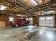 Spacious two-car garage with exposed ceiling, brick walls, truck, and ample room for parking and storage at 2228 Walker Ave, Burlington, NC 27215