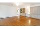 Spacious living room with built-in cabinetry and shelves and beautiful hardwood floors at 2228 Walker Ave, Burlington, NC 27215