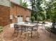 Wonderful brick patio next to a two-car garage, ideal for entertaining guests and enjoying outdoors at 2228 Walker Ave, Burlington, NC 27215