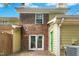 Backyard patio features a brick and siding exterior and sliding glass doors at 2233 Alpine Rd, Durham, NC 27707