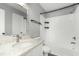 Bright bathroom features a shower/tub combo, marble counter tops, and modern fixtures at 2233 Alpine Rd, Durham, NC 27707