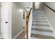 Bright entry featuring a staircase with stylish decorative pattern at 2233 Alpine Rd, Durham, NC 27707