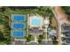 Aerial view of community amenities with a pool, tennis courts, clubhouse, parking, and playground at 2361 Rainy Lake St, Wake Forest, NC 27587