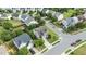 Aerial view of suburban two-story homes, with mature trees and well-maintained streets at 2361 Rainy Lake St, Wake Forest, NC 27587