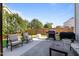 Spacious backyard featuring outdoor seating, grill, and lush green lawn at 2361 Rainy Lake St, Wake Forest, NC 27587