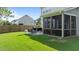 Large backyard with a patio, grill, seating area, and screened porch at 2361 Rainy Lake St, Wake Forest, NC 27587