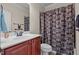 Bathroom features a dark wood vanity with a tub and shower at 2361 Rainy Lake St, Wake Forest, NC 27587