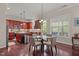 Cozy dining area features a glass table, comfortable seating, and stylish chandelier at 2361 Rainy Lake St, Wake Forest, NC 27587