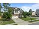 Lovely two-story home on a corner lot with a stone facade, attached garage, and well-maintained landscaping at 2361 Rainy Lake St, Wake Forest, NC 27587