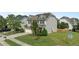 Attractive home featuring a stone facade, a two-car garage, and a neatly manicured lawn at 2361 Rainy Lake St, Wake Forest, NC 27587