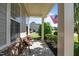 Inviting front porch with stone accents, comfortable seating, and view of the landscaped yard at 2361 Rainy Lake St, Wake Forest, NC 27587