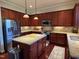 Well-equipped kitchen with stainless steel appliances, granite countertops, and a spacious island at 2361 Rainy Lake St, Wake Forest, NC 27587