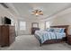 Spacious bedroom features trey ceiling, ceiling fan, neutral color palette and carpeted floor at 2361 Rainy Lake St, Wake Forest, NC 27587