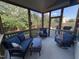 Cozy screened porch featuring comfortable seating and a view of the backyard at 2361 Rainy Lake St, Wake Forest, NC 27587