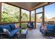 Comfortable screened porch with wicker furniture and backyard views at 2361 Rainy Lake St, Wake Forest, NC 27587