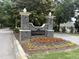 Stonegate neighborhood sign with landscaping and decorative stone pillars and a black sign at 2361 Rainy Lake St, Wake Forest, NC 27587