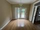 Dining room featuring a chandelier and access to the deck through glass doors at 2377 Vinson Rd, Clayton, NC 27527