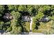 An aerial view of a well maintained home with lush landscaping and an inviting driveway in a peaceful neighborhood at 2409 Beechview Ct, Raleigh, NC 27615