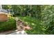 Expansive, well-maintained backyard featuring lush greenery and mature trees at 2409 Beechview Ct, Raleigh, NC 27615