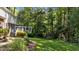 Spacious backyard with mature trees and a trampoline at 2409 Beechview Ct, Raleigh, NC 27615