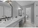 Elegant bathroom with double sinks, marble countertop, and modern fixtures with an attached lavatory at 2409 Beechview Ct, Raleigh, NC 27615