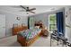 Comfortable bedroom featuring neutral walls, wood furniture, and natural light from dual windows at 2409 Beechview Ct, Raleigh, NC 27615