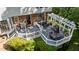 View of the spacious deck with multiple seating areas, grill, and a charming pergola at 2409 Beechview Ct, Raleigh, NC 27615