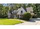 Beautiful two-story home with a lush lawn and a welcoming brick walkway at 2409 Beechview Ct, Raleigh, NC 27615