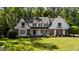 Charming two-story home with a manicured lawn and inviting front porch at 2409 Beechview Ct, Raleigh, NC 27615