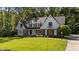 Attractive two-story home featuring a well-kept lawn and traditional architecture at 2409 Beechview Ct, Raleigh, NC 27615