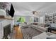 Comfortable living room featuring a fireplace, built-in shelving, and plush seating at 2409 Beechview Ct, Raleigh, NC 27615