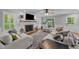 Bright and airy living room with fireplace and hardwood floors at 2409 Beechview Ct, Raleigh, NC 27615