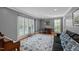 Inviting living room with large windows and neutral tones at 2409 Beechview Ct, Raleigh, NC 27615