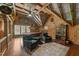 Recreation room with wooden walls, wooden plank ceiling, pool table, leather chairs and vintage decor at 2409 Beechview Ct, Raleigh, NC 27615