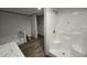 Contemporary bathroom equipped with a tub/shower, walk-in shower, and modern fixtures, offering a relaxing space at 2668 Bodie Currin Rd, Oxford, NC 27565