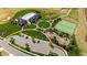 Aerial shot of community amenities including pool, tennis courts, playground, and lush green spaces at 272 High Woods Rdg, Chapel Hill, NC 27517