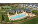 Aerial view of community pool and amenities, featuring lounge chairs and recreational facilities at 272 High Woods Rdg, Chapel Hill, NC 27517