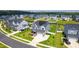 Overhead view of a residential area featuring a well-manicured lawn and solar panels at 272 High Woods Rdg, Chapel Hill, NC 27517