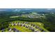 Scenic aerial view of 272 High Woods Way featuring an adjacent lake and local amenities at 272 High Woods Rdg, Chapel Hill, NC 27517