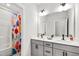 Stylish bathroom featuring a double vanity with modern fixtures, and a shower tub at 272 High Woods Rdg, Chapel Hill, NC 27517