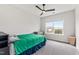 Well-lit bedroom featuring carpet flooring, neutral walls, and a ceiling fan at 272 High Woods Rdg, Chapel Hill, NC 27517