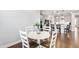 Bright breakfast nook with a round table and chairs, with views into the kitchen at 272 High Woods Rdg, Chapel Hill, NC 27517