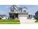 Charming two-story home with stone accents, inviting porch, and well-manicured lawn at 272 High Woods Rdg, Chapel Hill, NC 27517