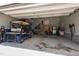 Neat garage with a golf cart, tools, storage racks, and an electric car charger at 272 High Woods Rdg, Chapel Hill, NC 27517