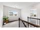 Upstairs hallway displaying access to multiple rooms and great natural lighting at 272 High Woods Rdg, Chapel Hill, NC 27517