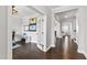 Bright hallway showcasing beautiful hardwood flooring and open doorway to an office space at 272 High Woods Rdg, Chapel Hill, NC 27517